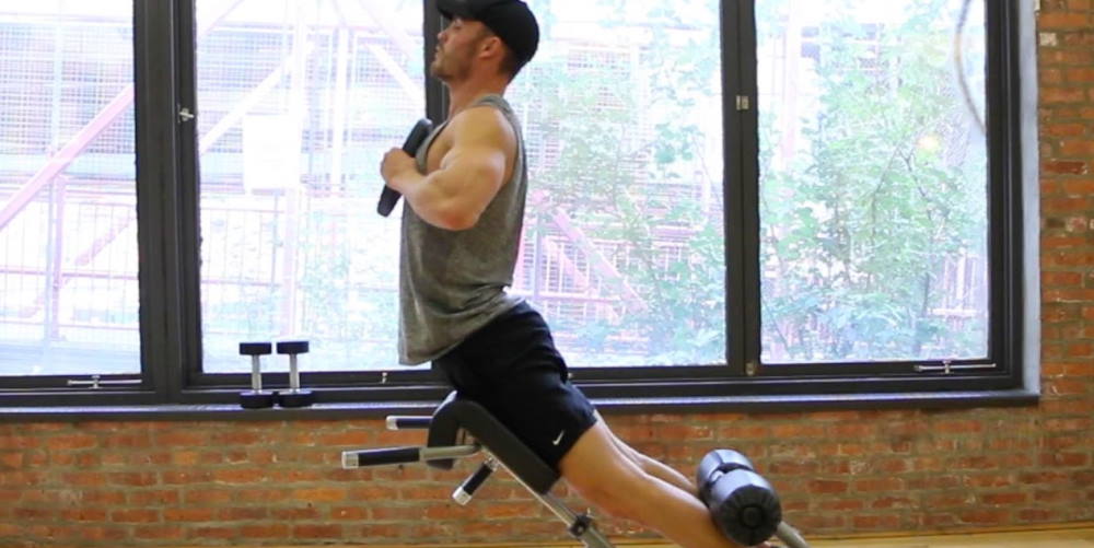 man doing roman chair exercises